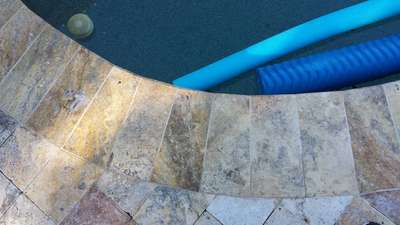 Paver Tile Installed on a Pool Deck Concrete Resurfacing by J & T Service